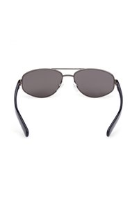 Metallbågar solglasögon med mörkgrå linser; oval form, tunna bågar och klara näsdukar. Slät textur och minimalistisk design.