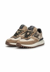 Beige and brown sneakers with textured fabric and smooth panels, featuring black laces, a patterned sole, and logo accents on the tongue.