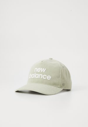 Light green corduroy baseball cap with a curved brim and embroidered "new balance" logo in white on the front.