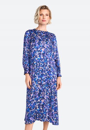 Robe à manches longues de couleur bleu marine avec un design à motifs mélangés de violet, rose et bleu. Tissu doux, longueur au genou, coupe décontractée.