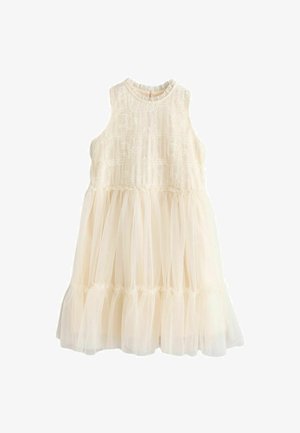 Vestido color crema con un top de encaje texturizado y falda de tul en capas. Presenta un escote redondo y un ribete rizado en la cintura.
