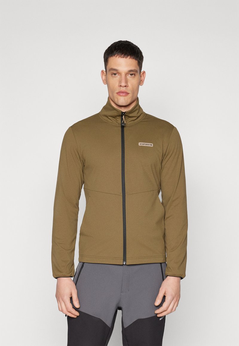 Olive green zip-up jacket with a high collar, made of smooth fabric, featuring a front logo and contrasting black zipper trim.