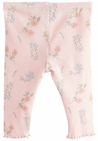 Lyserøde ribbede leggings med et blomster mønster, der har små orange, blå og gule blomster. Kantene har en flæset afslutning.