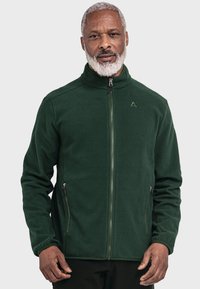 Dunkelgrüne Fleecejacke mit hohem Kragen, Reißverschluss vorne und zwei Seitentaschen. Weiche Textur mit dezentem Logo auf der Brust.