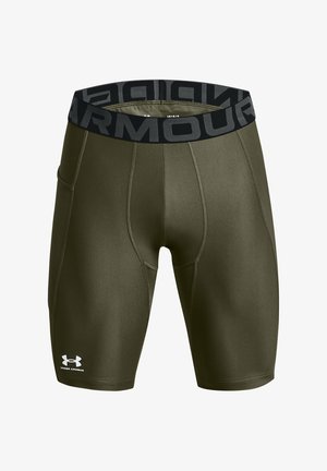 Olive green compression shorts with a black Under Armour waistband. Features flat seams and a snug fit for athletic performance.