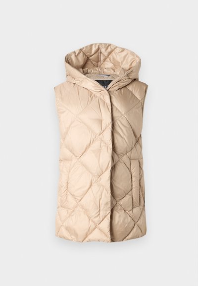 Šviesiai rudas, užsegamas liemuo su kapišonu, turintis blizgantį paviršių ir deimanto formos raštus. Be rankovių ir su priekiu atidarymu.