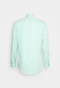 Light green striped long-sleeve shirt featuring a classic collar and rounded hem, with subtle texture and buttoned cuffs.