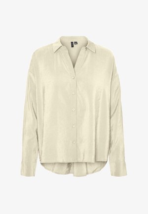 Chemise boutonnée beige clair avec col, fabriquée en tissu lisse. Elle possède des manches longues et un ourlet légèrement arrondi.