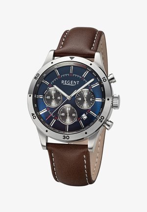 Montre chronographe en acier inoxydable avec cadran bleu, trois sous-cadrans, guichet de date à 4 heures, et bracelet en cuir marron avec coutures blanches.