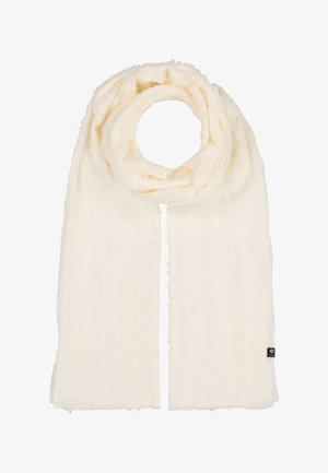 Cream-colored soft knit scarf with subtle ribbing, loosely looped, featuring a small black brand tag on one end.