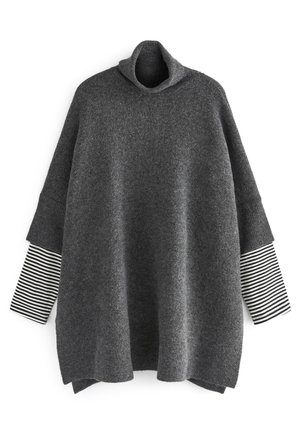 Dark gray knitted pullover with a high collar and three-quarter-length sleeves featuring a black and white striped pattern.
