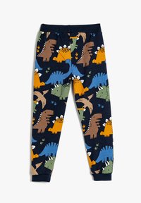 Blå bomuldsleggings med et farverigt dinosaurmønster i orange, grøn og brun, på en mørk marineblå baggrund og med elastisk talje.