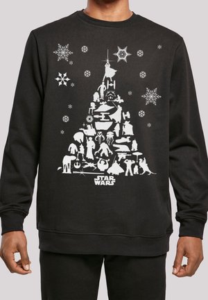 Schwarzer Pullover mit weißen Star Wars-Figuren und Schiffen, die in Form eines Weihnachtsbaums angeordnet sind, umgeben von Schneeflocken und dem Star Wars-Logo.