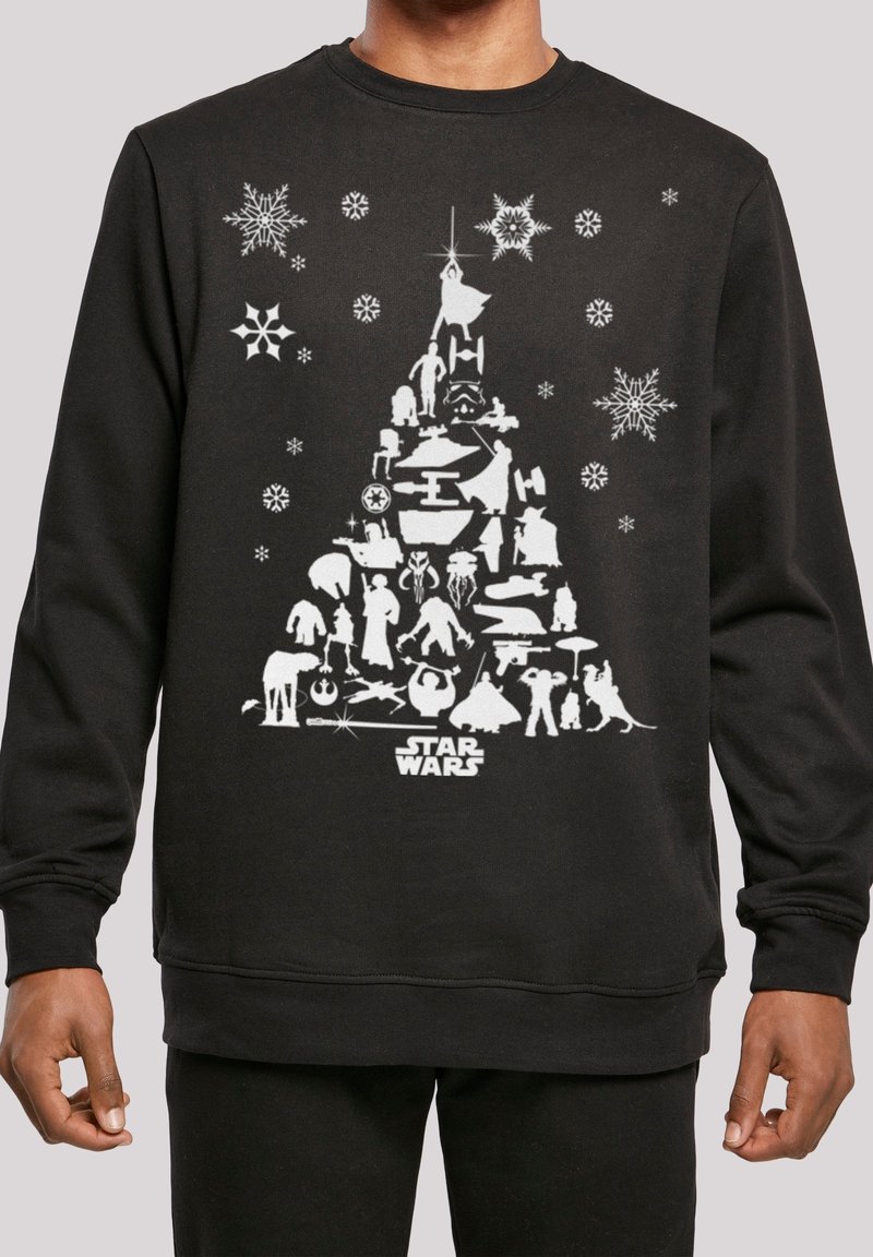 Sweat-shirt noir avec des personnages et des vaisseaux blancs de Star Wars disposés en forme de sapin de Noël, entourés de flocons de neige et du logo Star Wars.