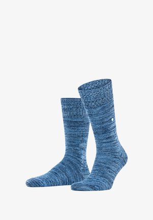 Calze blu lavorate a maglia con texture blu variate, lunghezza a metà polpaccio, cima a coste e un piccolo accento a pois bianchi. Materiale morbido ed elastico per il massimo comfort.