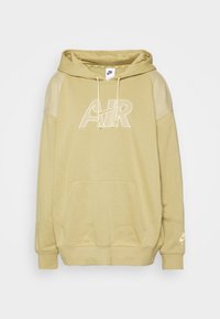 Beige Nike hoodie with mesh shoulder panels, front kangaroo pocket, drawstring hood, and white "AIR" logo across the chest and sleeve.