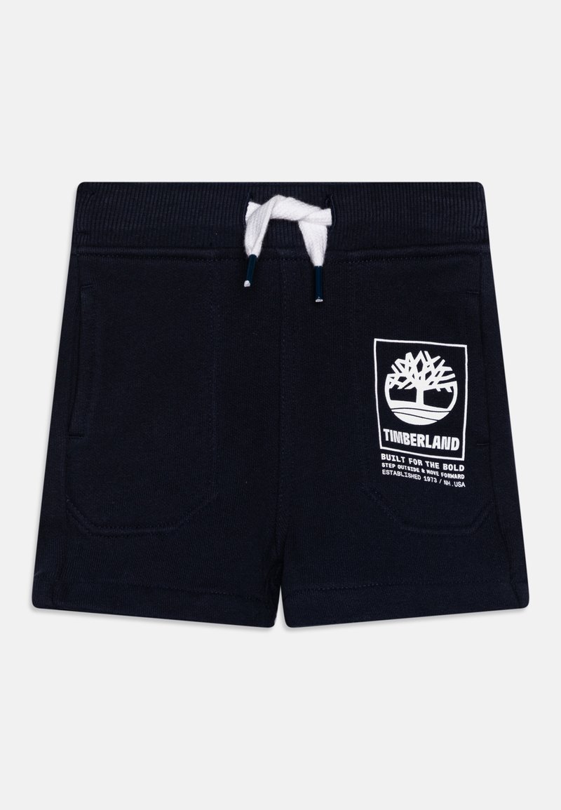 Short bleu marine avec cordon blanc, poches avant et logo Timberland avec texte sur la jambe gauche.