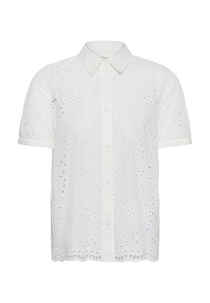 Bijela bluza kratkih rukava s kopčanjem na gumbe, šiljastim ovratnikom i cvjetnim otvorenim čipkastim uzorkom po cijelom materijalu.