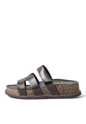 Brown leather slide sandal with cork platform sole, adjustable strap at the ankle, and open toe design on white background.