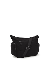 Borsa a tracolla in tessuto nero con strap regolabile, tasca con cerniera frontale e scomparti laterali con zip su sfondo bianco.