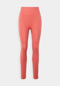 Legginsy z wysokim stanem w jednolitym kolorze koralowym, wykonane z gładkiego, elastycznego materiału, charakteryzujące się dopasowanym krojem i bezszwowym designem.
