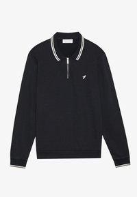 Sort langærmet polo med en kvart lynlås, med hvide striber på kraven og manchetten, samt et lille broderet logo på brystet.