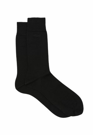 Par sorte midt-på-låret sokker med ribbede manchetter og subtil ton-i-ton logo nær toppen på hvid baggrund.