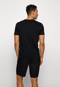 BOSS TEE CURVED - T-shirt basic - black