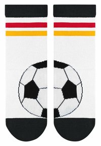 Białe skarpetki z czarnym piętą i palcami, z grafiką piłki nożnej oraz czerwonymi, żółtymi i czarnymi paskami na górze.