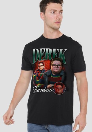 Man in black T-shirt featuring three images of a boy wearing glasses and colorful striped sweater, with the text "Derek Turnbow."
