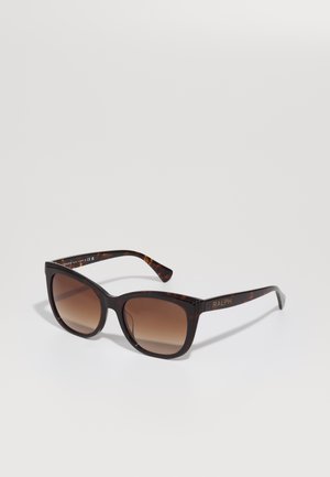 Tortoiseshell sunglasses with a glossy finish, square shape, dark brown gradient lenses, and gold "RALPH" logo on the arm.