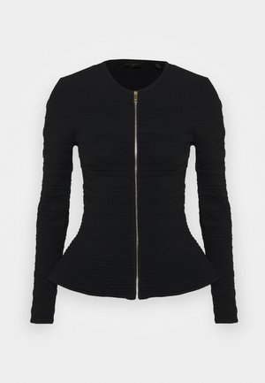 Veste noire texturée à manches longues ajustée avec col rond et fermeture éclair centrale dorée, s'évasant légèrement à la taille.
