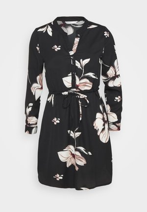 Black dress with long sleeves, floral pattern in soft pink, collarless design, button front, and a tie belt at the waist. Lightweight fabric.
