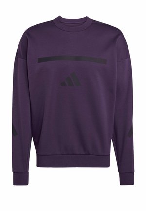 Lilla sweatshirt med rund hals, med sorte grafiske striber og et logo. Fremstillet af et blødt materiale med ribbede manchetter og nederste kant.