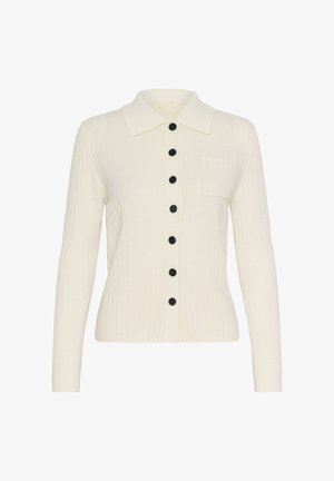 Kremna rebrovana jakna z izostrenim ovratnikom, dolgimi rokavi, črnimi gumbi spredaj in enim žepom na prsih.