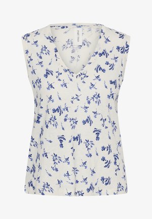 Haut blanc sans manches avec un col en V présentant un motif floral bleu sur toute la surface et un ourlet droit.