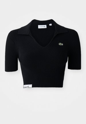Polo shirt nera corta realizzata in tessuto a coste con scollo a V, maniche corte e logo ricamato verde sul lato sinistro del petto. Etichetta bianca nell'orlo.