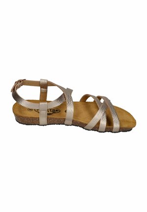 Women's open-toe sandal with metallic straps, ankle buckle, cushioned cork sole, and flat black treaded bottom shown in side view.