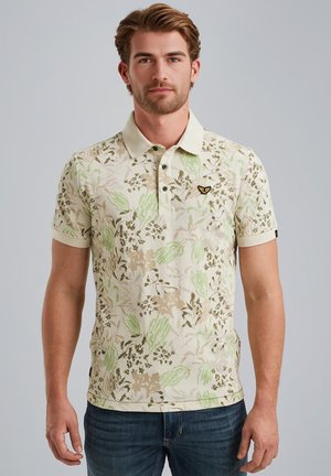 Kurzarm-Polohemd in Creme mit einem grünen und braunen Blumenmuster. Verfügt über einen Kragen und ein kleines gesticktes Logo auf der Brust.