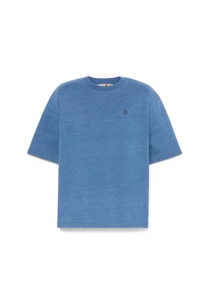 T-shirt a maniche corte azzurro chiaro realizzata in materiale morbido. Presenta una scollatura rotonda e un piccolo logo sul petto. Design dal taglio ampio.