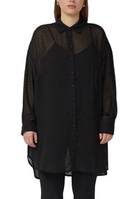 Schwarzes transparentes Hemd mit Knopfleiste, kleinem Punktmuster, langen Ärmeln und klassischem Kragen. Für eine lockere Passform entworfen, mit abgerundetem Saum.