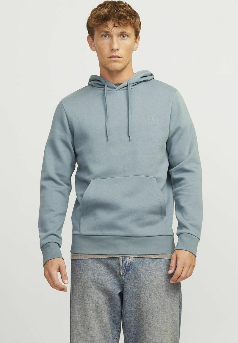 Light blue hoodie made of soft cotton-blend material. Features a front kangaroo pocket, drawstring hood, and ribbed cuffs and hem.