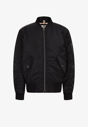 Blouson aviateur noir, tissu lisse, fermeture éclair frontale, poignets et ourlet côtelés, poches latérales et poche zippée sur la manche. Doublé d'un intérieur à motif.