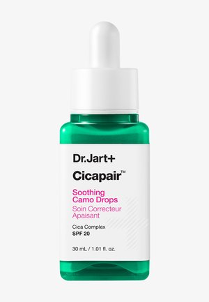 Dr.Jart+ Cicapair Soothing Camo Drops serumflesje met druppelaar, SPF 20, 30 ml, groene en witte verpakking met roze en zwarte tekst.