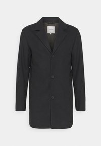 Abrigo de mezcla de lana negro con cuello festonado, diseño de un solo botón y tres botones frontales; cuenta con mangas largas y un corte recto.