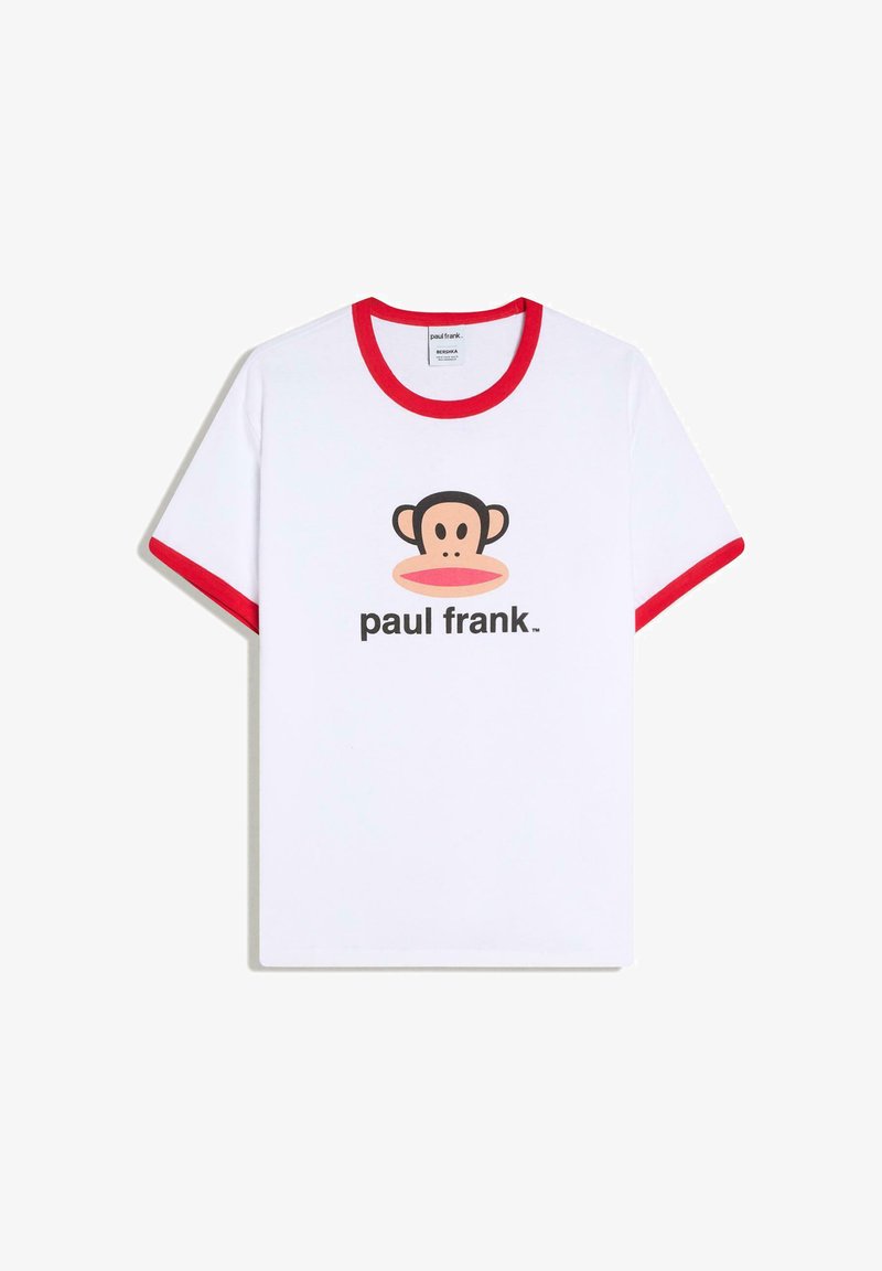 White short-sleeve T-shirt with red collar and sleeve cuffs, featuring a cartoon monkey face and "paul frank" text on the front.