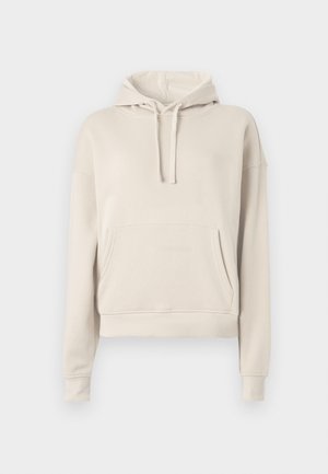 Beige hettegenser laget av mykt materiale, med en frontlomme, justerbar hette med snor og ribbede mansjetter og nederkant.