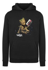 Black hoodie featuring an illustration of a character with a wooden texture, holding a cassette tape with a black cord.