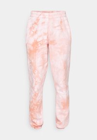 Lys rosa joggebukser med tie-dye-design, myk tekstur, elastisk linning og ribbestrikkede mansjetter ved anklene.