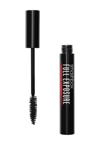 Schwarzer Mascara-Tube mit matter Oberfläche, beschriftet mit "VOLLSTÄNDIGE ENTHÜLLUNG." Enthält einen dicken, borstigen Applikator.
